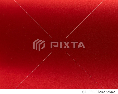Fiery crimson paper background with a velvety smooth texture and rich ruby tones. Soft satin Fiery crimson paper background with a velvety smooth texture and rich ruby tones. Soft satin 123272562