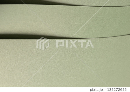 Pastel sage green paper background with a soft texture and layered folds. Muted olive and moss tones Pastel sage green paper background with a soft texture and layered folds. Muted olive and moss tones 123272633