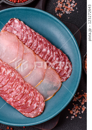Delicious fresh smoked sausages cut with slices 123272643