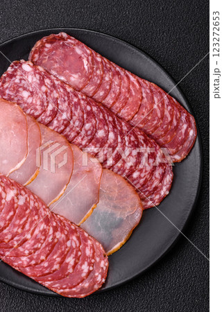 Delicious fresh smoked sausages cut with slices 123272653
