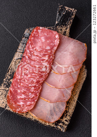 Delicious fresh smoked sausages cut with slices Delicious fresh smoked sausages cut with slices 123272661