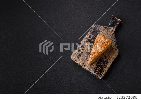 Piece of sweet layer cake Napoleon with custard 123272689