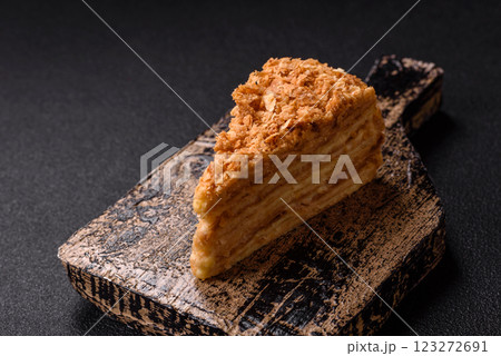 Piece of sweet layer cake Napoleon with custard 123272691
