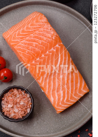 Fresh raw salmon steak with spices and herbs 123272706