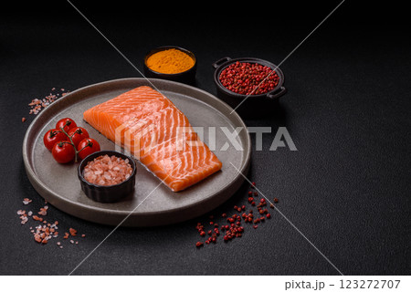 Fresh raw salmon steak with spices and herbs 123272707