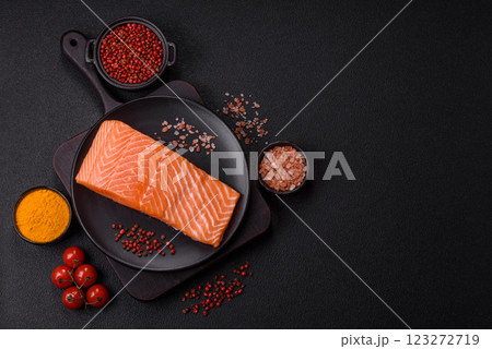 Fresh raw salmon steak with spices and herbs Fresh raw salmon steak with spices and herbs 123272719