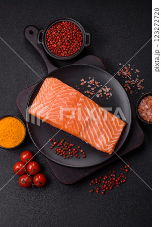 Fresh raw salmon steak with spices and herbs Fresh raw salmon steak with spices and herbs 123272720