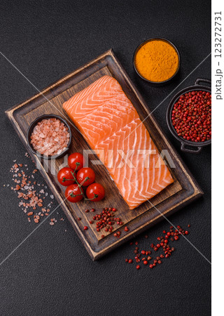 Fresh raw salmon steak with spices and herbs 123272731