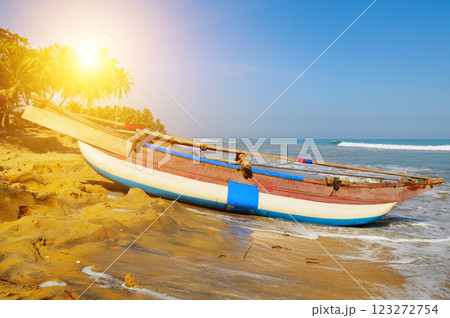 Untouched tropical beach with palms and fishing boats in Sri-Lanka Untouched tropical beach with palms and fishing boats in Sri-Lanka 123272754