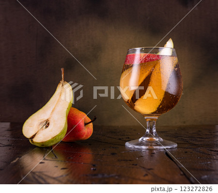 Fruit drink in a glass. Sweet drink in a glass. Still life with fruit on a drink. 123272826