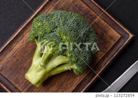 A sprig of raw green broccoli as an ingredient for a healthy meal 123272854