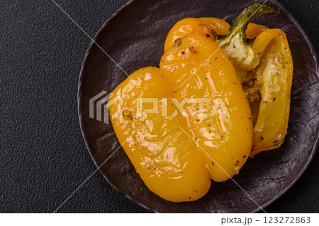 Yellow sweet pepper cut in half and grilled with salt, spices and herbs 123272863