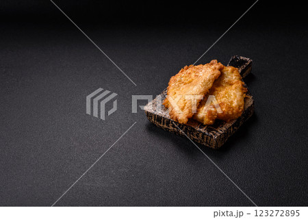 Grilled chicken or turkey chop with salt, spices and herbs 123272895