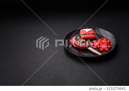 Natural popsicle ice cream on a stick in the style and colors of Christmas 123273041