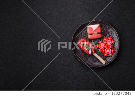 Natural popsicle ice cream on a stick in the style and colors of Christmas 123273042