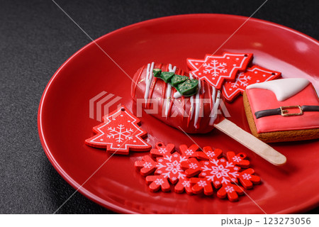 Natural popsicle ice cream on a stick in the style and colors of Christmas 123273056