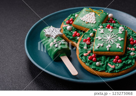 Natural popsicle ice cream on a stick in the style and colors of Christmas 123273068