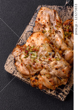 Grilled boneless chicken thigh with salt, spices and herbs 123273653