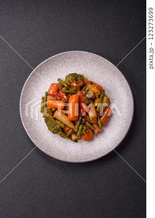 Mix of vegetables corn, carrots, peppers, broccoli, onions in teriyaki sauce 123273699