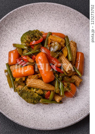 Mix of vegetables corn, carrots, peppers, broccoli, onions in teriyaki sauce 123273702