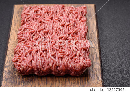 Fresh raw ground minced beef with salt and spices Fresh raw ground minced beef with salt and spices 123273954