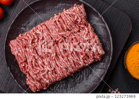 Fresh raw ground minced beef with salt and spices 123273969