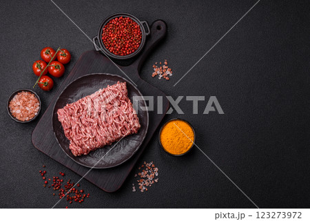 Fresh raw ground minced beef with salt and spices Fresh raw ground minced beef with salt and spices 123273972