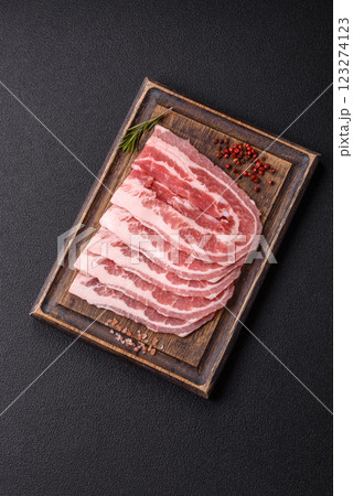 Fresh raw bacon sliced with spices and herbs 123274123