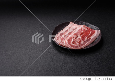 Fresh raw bacon sliced with spices and herbs 123274133