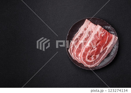 Fresh raw bacon sliced with spices and herbs 123274134