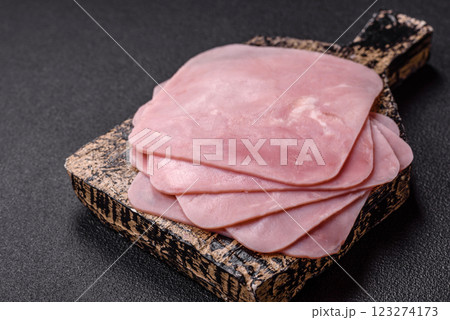 Ham cut into square slices for making delicious nutritious sandwiches Ham cut into square slices for making delicious nutritious sandwiches 123274173