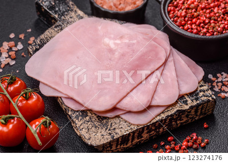 Ham cut into square slices for making delicious nutritious sandwiches Ham cut into square slices for making delicious nutritious sandwiches 123274176