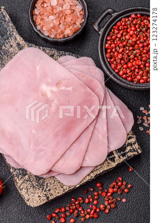 Ham cut into square slices for making delicious nutritious sandwiches Ham cut into square slices for making delicious nutritious sandwiches 123274178