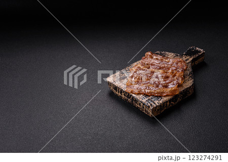 Crispy fried pork bacon sliced with salt, spices and herbs Crispy fried pork bacon sliced with salt, spices and herbs 123274291