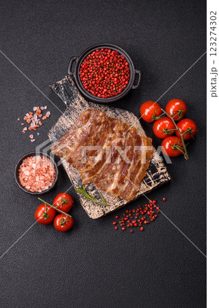 Crispy fried pork bacon sliced with salt, spices and herbs Crispy fried pork bacon sliced with salt, spices and herbs 123274302