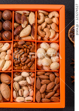 Box with various nuts cashew, macadamia, peanut, cedar, pecan, walnut, brazil, hazelnut 123274527