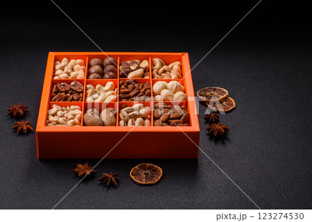 Box with various nuts cashew, macadamia, peanut, cedar, pecan, walnut, brazil, hazelnut 123274530