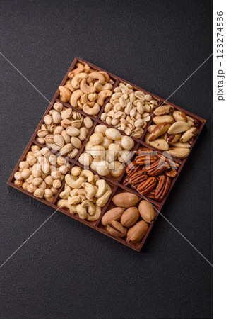 Box with various nuts cashew, macadamia, peanut, cedar, pecan, walnut, brazil, hazelnut 123274536