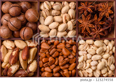 Box with various nuts cashew, macadamia, peanut, cedar, pecan, walnut, brazil, hazelnut 123274558