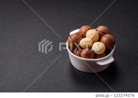 Delicious nutritious macadamia nuts in ceramic bowl Delicious nutritious macadamia nuts in ceramic bowl 123274576
