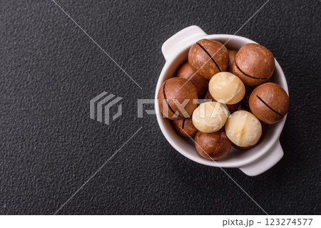 Delicious nutritious macadamia nuts in ceramic bowl Delicious nutritious macadamia nuts in ceramic bowl 123274577