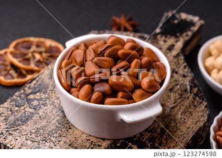 Delicious nutritious cedar nuts in ceramic bowl 123274598