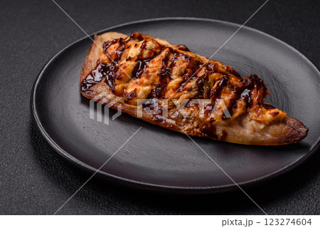 Grilled mackerel fillets with cheese, salt, spices and herbs 123274604