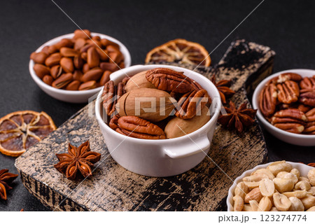Delicious nutritious pecan nuts in ceramic bowl Delicious nutritious pecan nuts in ceramic bowl 123274774
