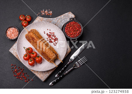 Lula kebab meat fried on a fire in breading with salt, spices and herbs Lula kebab meat fried on a fire in breading with salt, spices and herbs 123274938