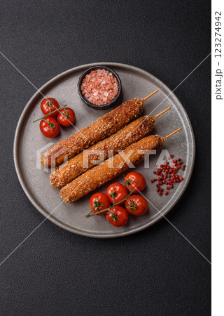 Lula kebab meat fried on a fire in breading with salt, spices and herbs Lula kebab meat fried on a fire in breading with salt, spices and herbs 123274942