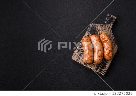 Grilled sausages with spices and herbs Grilled sausages with spices and herbs 123275029