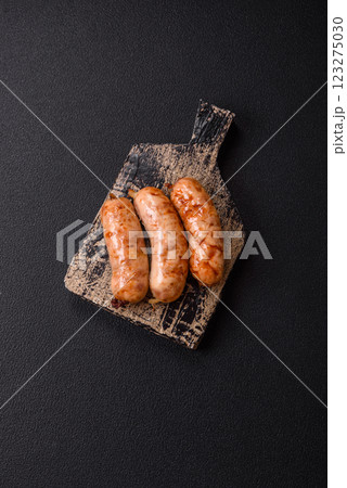 Grilled sausages with spices and herbs Grilled sausages with spices and herbs 123275030