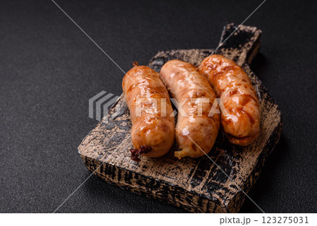 Grilled sausages with spices and herbs Grilled sausages with spices and herbs 123275031