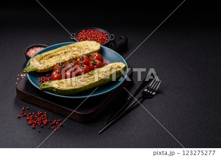 Delicious zucchini cut into two halves baked with salt, spices and herbs Delicious zucchini cut into two halves baked with salt, spices and herbs 123275277